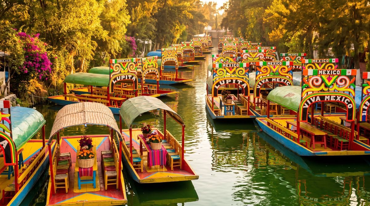 Colorful trajinera boats gliding along the canals of Xochimilco in Mexico City