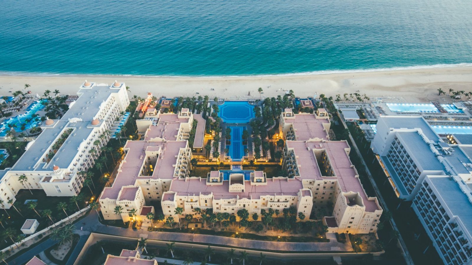 Stunning aerial shot of Cabo San Lucas beachfront resort showcasing architecture and ocean beauty.