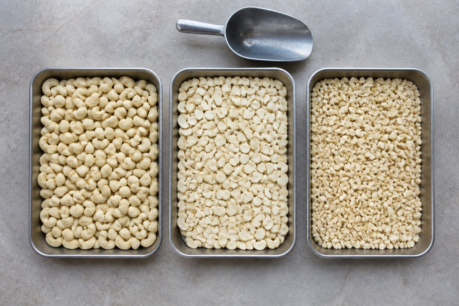 Whole, split, and piece cashew forms in separate trays