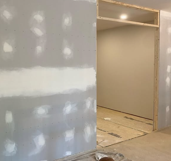 The same wall after drywall was hung, finished and painted