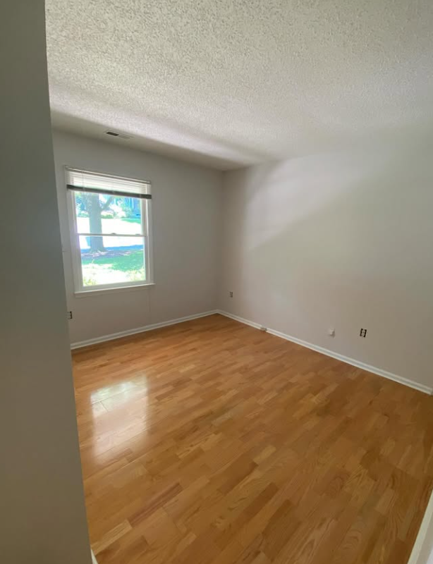 The same bedroom with finished hardwood floors