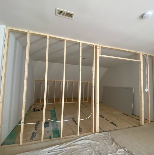 Wall framing before new drywall was hung and finished