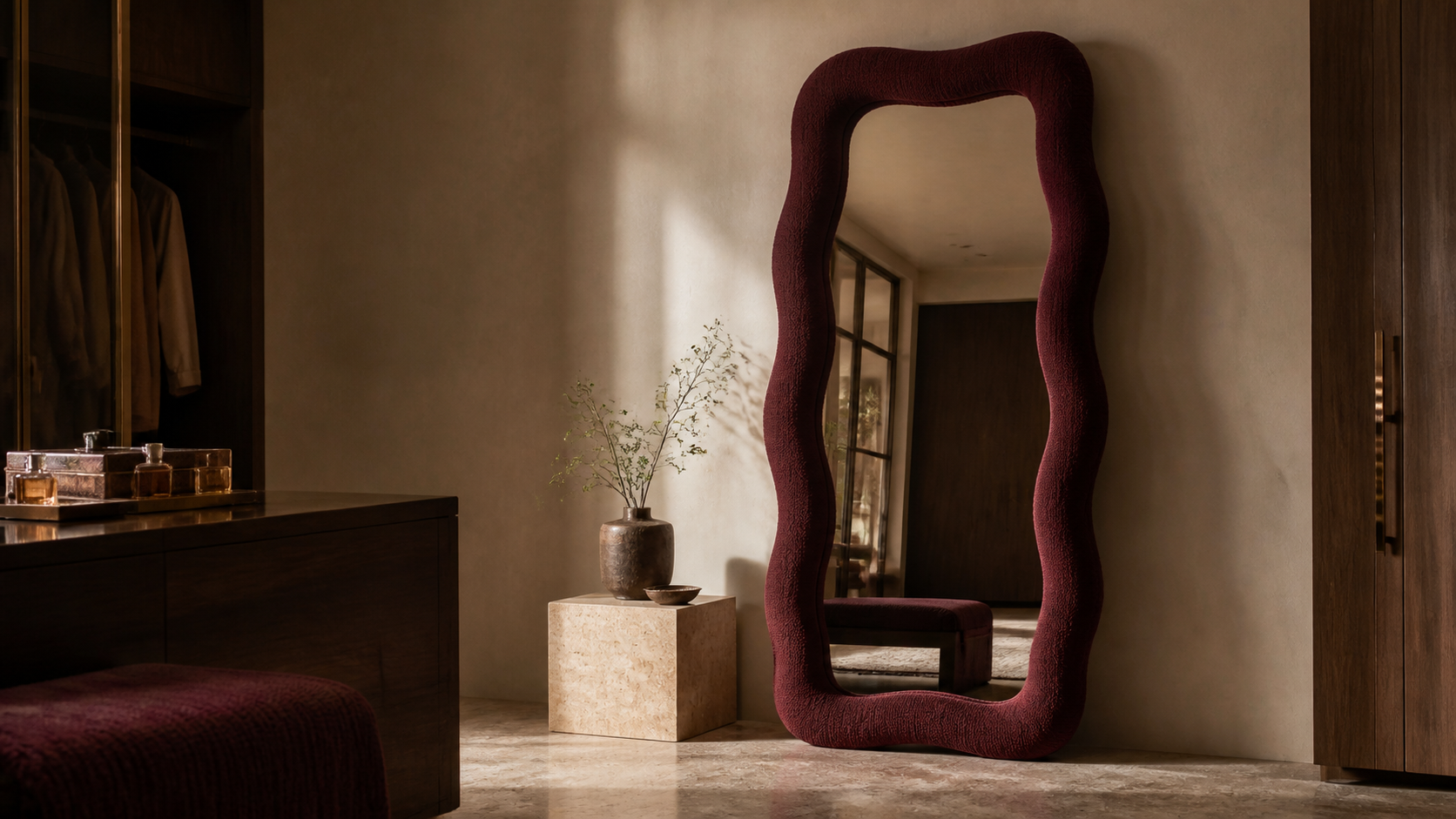 Burgundy KAIRA handcrafted wavy mirror in a warm contemporary interior
