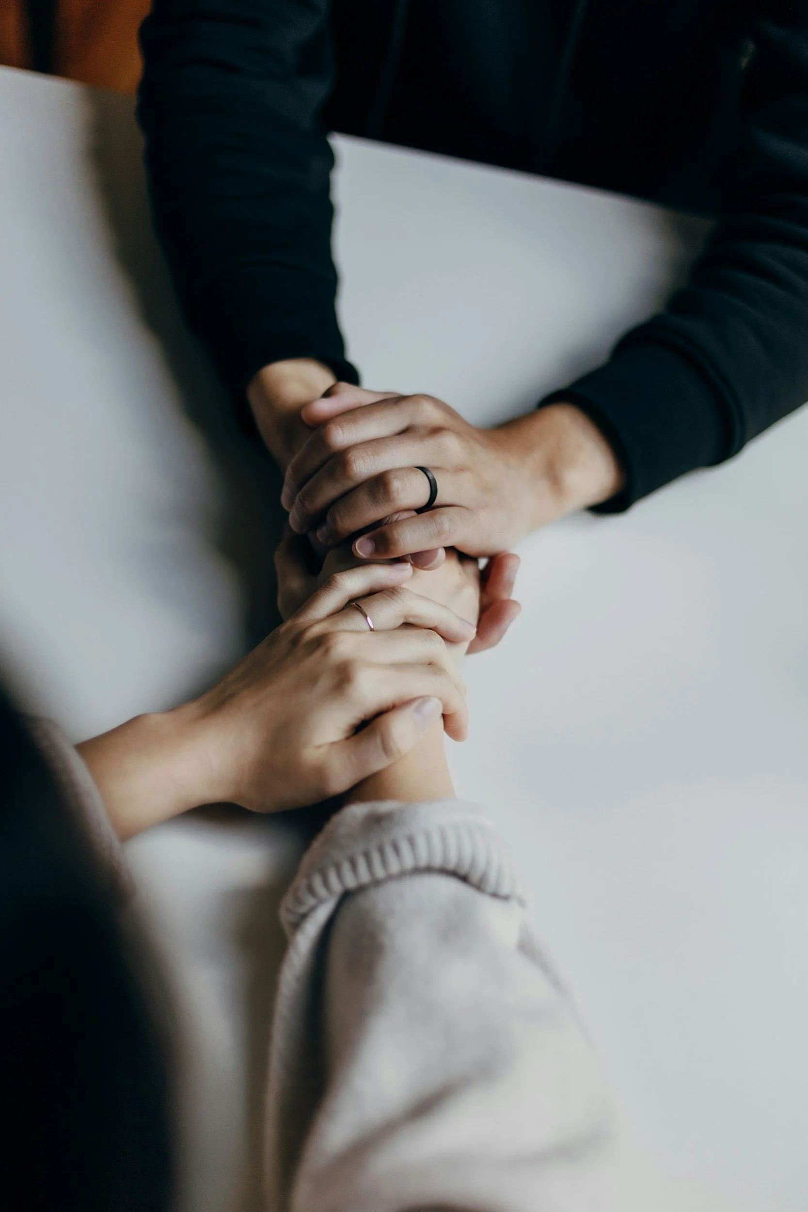 Supportive hands during trauma therapy